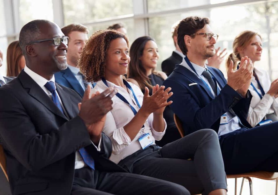 Group of people clapping at event